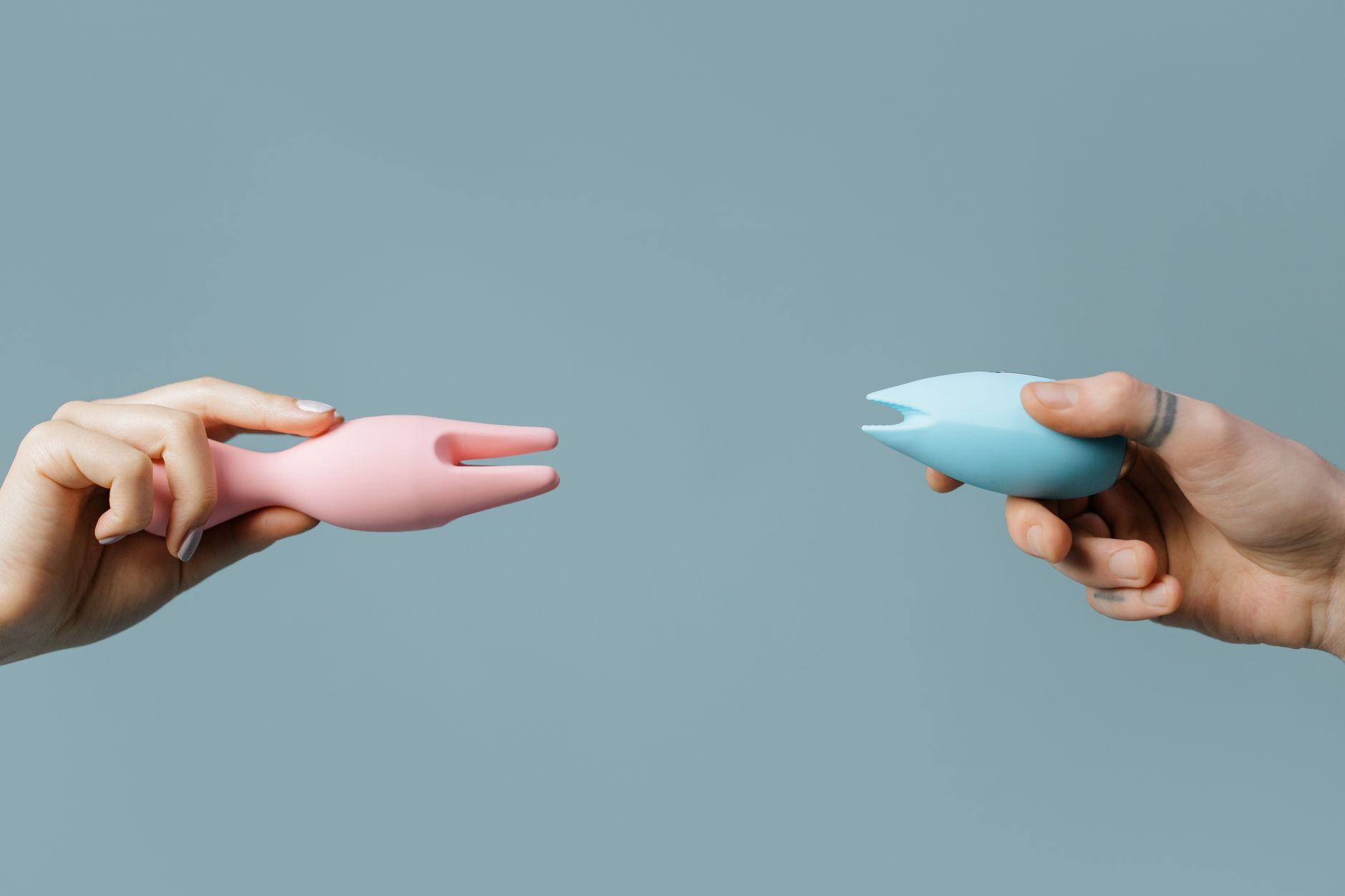 Hand holding a fresh lemon against a vivid yellow background, symbolizing slow, deliberate pleasure